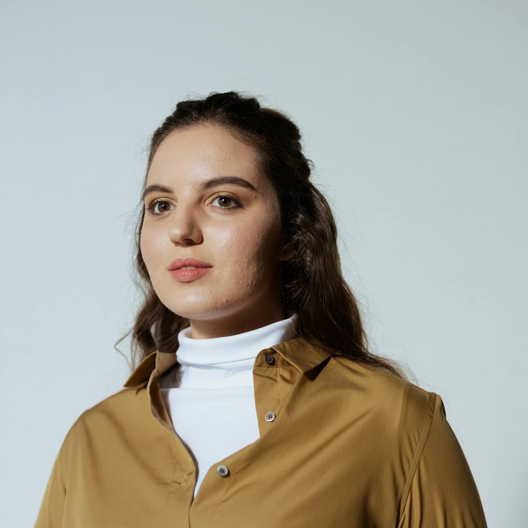 Photo of a Beautiful Woman in a White Turtleneck Shirt